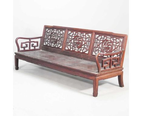 A Chinese carved hardwood bench, with a pierced back, on square legs186w x 66d x 75d