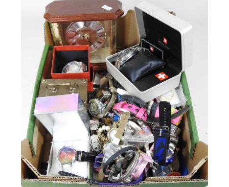 A collection of wristwatches, some boxed, to include a mantel clock