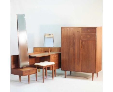 A 1960s teak dressing table, with stool, together with a matching cabinet, with a fitted interior and a headboard (4)