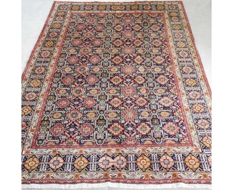 A Persian tabriz carpet, with all over medallions, within multiple borders, 345 x 246cm