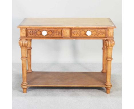 An antique carved pine side table, with an undertier107w x 58d x 80hcm