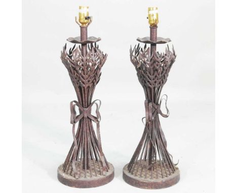 A pair of rustic iron table lamp bases, 62cm high (2)