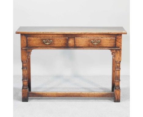An oak side table, of Georgian design, on turned legs108w x 35d x 71h cm