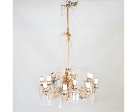 A brass twelve branch chandelier, with cut glass drops, 52cm diameter