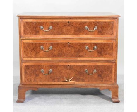 A George III and later burr walnut veneered chest, with stellar inlay, on bracket feet