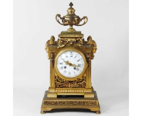 A French ormolu mantel clock, of Neoclassical design, the white enamel dial with Roman hours, having a twin train movement, 4