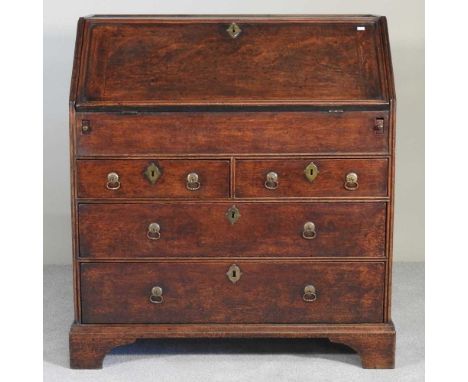 An 18th century oak bureau, with a well, on bracket feet92w x 52d x 101h cm