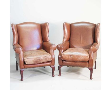 A pair of Laura Ashley brown leather upholstered wing armchairs, on cabriole legs (2)Overall condition looks to be complete a