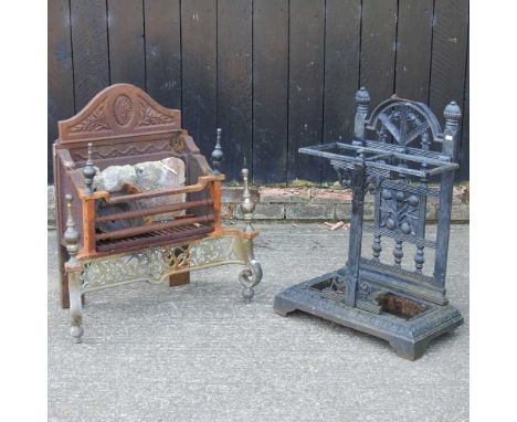 An iron fire grate, 76cm high, together with a cast iron stick stand (2)Overall condition of the grate is quite heavily ruste