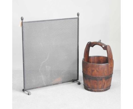 A Chinese metal bound wooden bucket, together with a metal firescreen, 90 x 70cm (2)