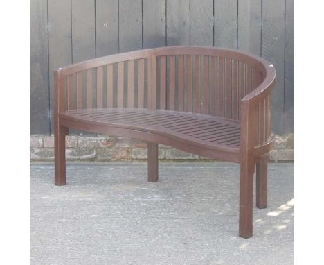 A painted teak garden bench, with a curved back, 150cm wide