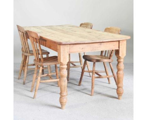 A pine dining table, on turned legs, together with four beech stick back dining chairs (5)183w x 90d x 76hcm