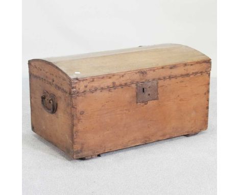 A stripped pine dome top trunk, with a hinged lid