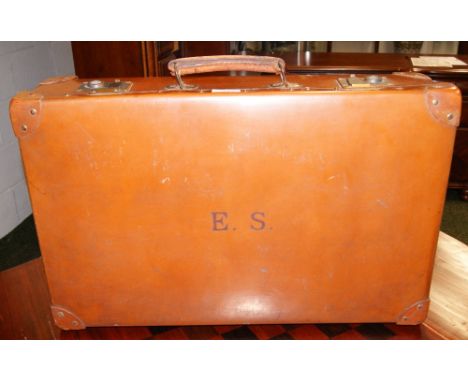 A vintage tan-leather suitcase