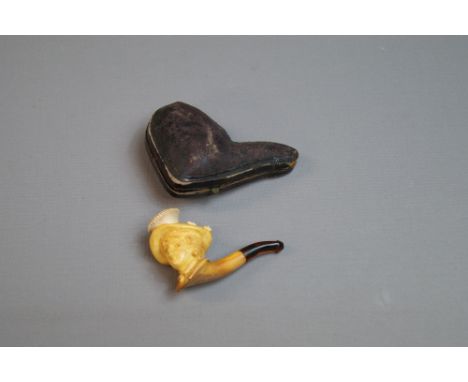 A cased carved meerschaum pipe, the bowl in the form of a lady wearing a hat