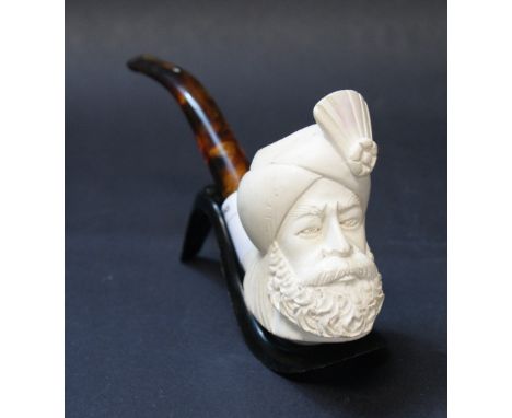 A carved meerschaum pipe, the bowl in the form of a Turk's head