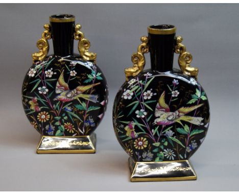 A pair of Victorian Oriental-style moon-flask vases, having applied painted detail with birds, butterflies, foliage and gilt 