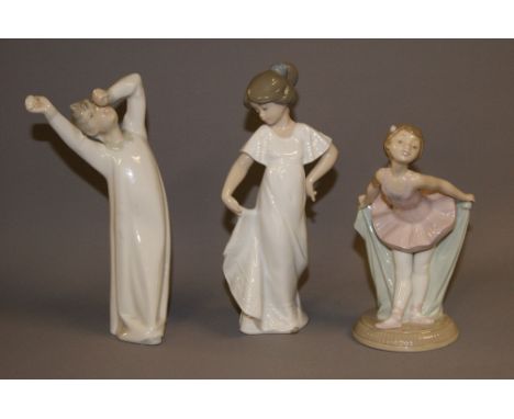 Nao, A glazed ceramic figure "How Pretty", boxed, together with a Lladro figure and a second Nao figure 