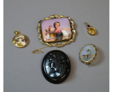 A 9ct amethyst and citrine pendant, ceramic and pinchbeck brooch, a jet-type carved brooch and other vintage jewellery