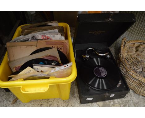 A Columbia portable gramophone and a quantity of records.