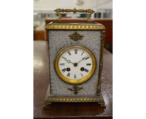 A French decorative mantle clock with eight day movement striking on a bell.