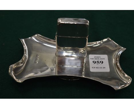An interesting silver combination lighter and ashtray.