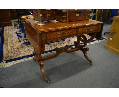 A very good Regency rosewood and brass inlaid sofa table.