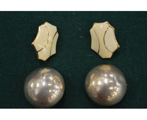 A pair of Monet earrings and another pair of earrings.