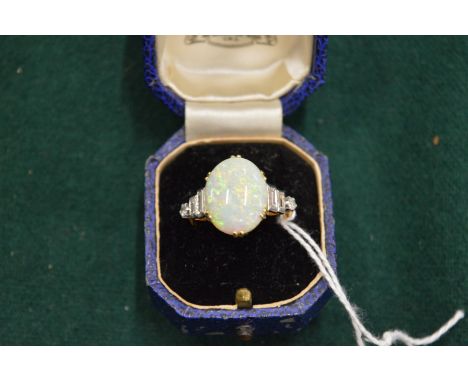 A good 18ct yellow gold diamond and opal ring.