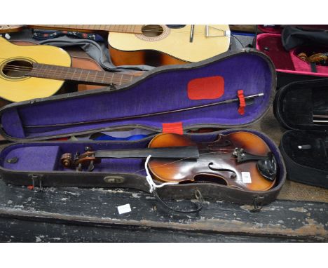 A violin with case and bow, the violin labelled Antonio Stradivarius.