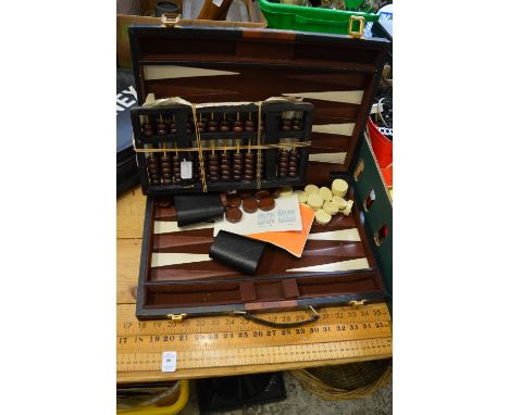 Three boxwood rulers, two abacuses and backgammon set.