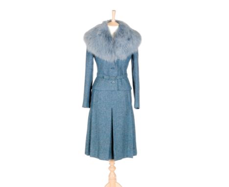 Christian Dior - A ladies vintage fitted blue woollen skirt suit, circa 1960s, the jacket with a blue fur trim and waist belt