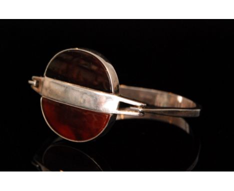 Nils Erik From - A 1970s Danish Sterling Silver modernist bangle, the hinged head centred by a circular panel, collar set wit