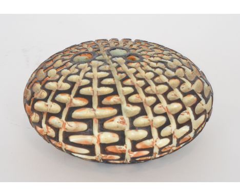 Beatrice Bolton and Guy Sydenham - Poole Pottery - An Atlantis pebble, the terracotta body with a carved repeat pattern, impr