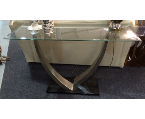 Unknown - A glass topped console table with brushed steel twin supports over a black lacquered base, height 76cm, width 122cm