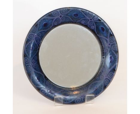 Hilkka-Lisa Ahola - Arabia - A Finnish ceramic wall mirror of circular form with a hand painted border with a repeat scroll w