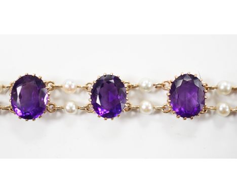 A 1970's Edwardian style 9ct gold amethyst and cultured pearl cluster set bracelet, 17.5cm, gross weight 15.9 grams.