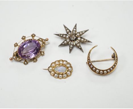 An early 20th century 9ct, amethyst and seed pearl set oval brooch, 33mm, a yellow metal and seed pearl set crescent brooch, 