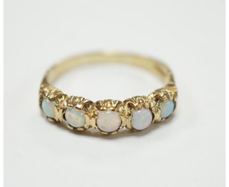 A modern 9ct gold and five stone white opal set half hoop ring, size T/U, gross weight 2.9 grams.