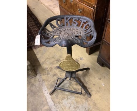 A cast iron tractor seat stool, height 70cm