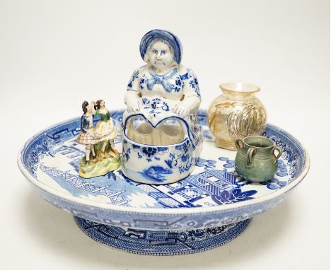 A group of mixed ceramics including a Moser crackle glass fish vase, Delft seated lady figurine, willow pattern comport, figu