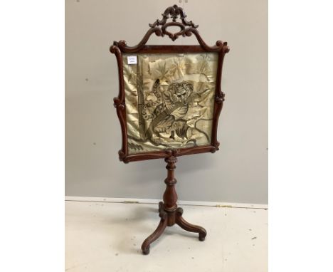A Victorian rosewood polescreen, inset Japanese embroidered panel, decorated with a tiger, height 128cm