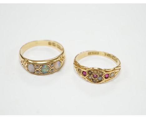 A late Victorian 18ct gold and three stone white opal set half hoop ring, with diamond chip spacers, size M (opal chipped), t