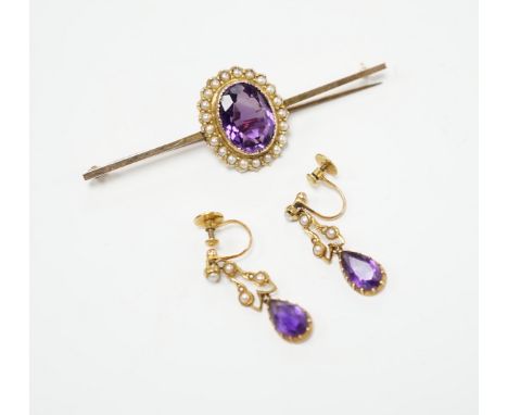 A yellow metal, amethyst and seed pearl cluster set bar brooch, 65mm and a pair of similar drop ear clips, gross weight 10 gr