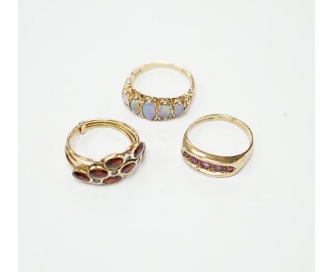 Two recent 9ct gold and gem set rings, including graduated five stone opal half hoop ring, together with a continental and ge