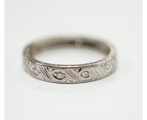 An 18ct white metal and diamond chip set full eternity ring, size K, gross weight 3 grams.
