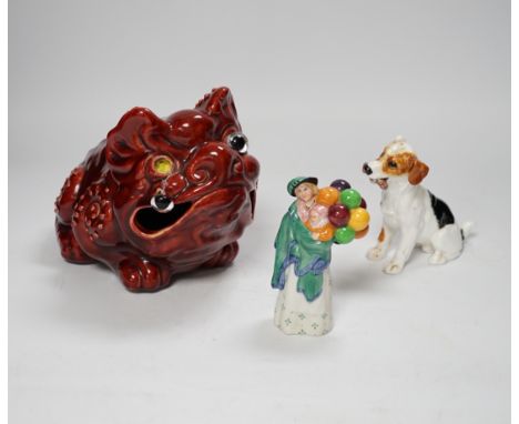 A Burmantofts style grotesque toad spoon warmer,  a Royal Doulton dog ornament and The Balloon Seller, toad 18cm long