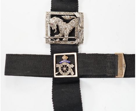 A black sash bracelet with diamond and enamel set Royal Fusiliers buckle, together with a similar sash with diamond set 'Char