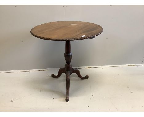 A George III style circular mahogany tilt top tripod tea table, diameter 76cm, height 72cm