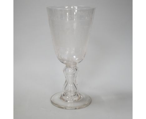 A lead crystal commemorative Gretna Green goblet, with fine engraving of a blacksmith and couple signing the register on an a